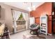 Cozy sitting area with a large window, ample lighting, and comfortable seating at 41219 W Brandt Dr, Maricopa, AZ 85138