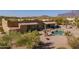 Backyard featuring a pool, covered patio, cacti and desert landscaping at 4185 S Redtail Trl, Gold Canyon, AZ 85118