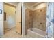 Bathroom featuring a tiled shower with a natural wood door at 4185 S Redtail Trl, Gold Canyon, AZ 85118