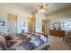 Comfortable bedroom featuring a spacious layout, wood accents, and natural light at 4185 S Redtail Trl, Gold Canyon, AZ 85118