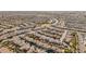 Aerial view of a residential neighborhood with various house styles at 44231 W Roth Rd, Maricopa, AZ 85138