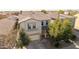 Two-story house with tile roof, two-car garage, and landscaping at 44231 W Roth Rd, Maricopa, AZ 85138