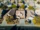 Aerial front-on street view showcases the home, driveway, and front yard with surrounding neighborhood at 44250 W Vineyard St, Maricopa, AZ 85139