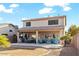 View of the spacious backyard and covered patio area, ideal for outdoor dining and relaxation at 44250 W Vineyard St, Maricopa, AZ 85139