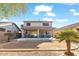 Large backyard with covered patio and desert landscaping at 44250 W Vineyard St, Maricopa, AZ 85139