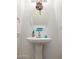Clean powder room with a pedestal sink, and decorative accents at 44250 W Vineyard St, Maricopa, AZ 85139