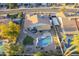 Backyard oasis featuring a sparkling pool, covered patio, outdoor seating, and an artificial turf area at 5507 E Grandview Rd, Scottsdale, AZ 85254