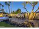 Relaxing backyard patio area with a pool, desert landscaping, and outdoor seating, perfect for entertaining at 5507 E Grandview Rd, Scottsdale, AZ 85254