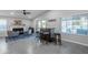 Open-concept layout featuring a bar area, fireplace, and seamless flow into the living space at 5507 E Grandview Rd, Scottsdale, AZ 85254