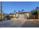 Charming single-story home with well-manicured landscaping, a spacious driveway, and a welcoming two-car garage at 5507 E Grandview Rd, Scottsdale, AZ 85254
