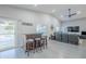 Inviting living space with a bar area and access to the outdoor pool and patio area at 5507 E Grandview Rd, Scottsdale, AZ 85254