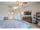 Well-lit main bedroom with dual closets, a ceiling fan, and an en suite bathroom at 5507 E Grandview Rd, Scottsdale, AZ 85254