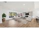 Light and airy living room with comfortable seating and hardwood floors at 5719 E Sweetwater Ave, Scottsdale, AZ 85254