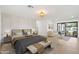 Main bedroom with sitting area and sliding glass doors to backyard at 5719 E Sweetwater Ave, Scottsdale, AZ 85254