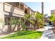 Exterior view of apartment buildings along a landscaped walkway with manicured green spaces at 5995 N 78Th St # 2030, Scottsdale, AZ 85250