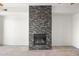 Contemporary gas fireplace with a modern stone surround at 6745 N 93Rd Ave # 1138, Glendale, AZ 85305