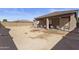 Large backyard with a covered patio area, ready for landscaping and outdoor enjoyment at 676 N 156Th Ln, Goodyear, AZ 85338