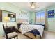 Bright and fun bedroom with playful decorations, a cozy bed, and large windows at 676 N 156Th Ln, Goodyear, AZ 85338