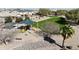 Community playground featuring covered picnic area, modern play structure, swings and desert landscaping at 676 N 156Th Ln, Goodyear, AZ 85338
