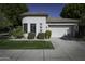 Single-story home with stucco exterior, attached garage, and landscaped front yard at 7340 E Vaquero Dr, Scottsdale, AZ 85258