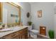 Elegant bathroom with wood vanity, large mirror, and tiled floor at 8540 E Mcdowell Rd # 55, Mesa, AZ 85207