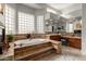 Elegant bathroom with soaking tub, double vanity, and glass block windows at 8540 E Mcdowell Rd # 55, Mesa, AZ 85207