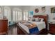 Bright bedroom with a wooden bed frame and window seating at 8540 E Mcdowell Rd # 55, Mesa, AZ 85207