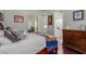 Spacious bedroom with a wooden bed frame and en-suite bathroom at 8540 E Mcdowell Rd # 55, Mesa, AZ 85207