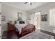 Cozy bedroom with wooden bed frame and built-in shelving at 8540 E Mcdowell Rd # 55, Mesa, AZ 85207