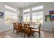 Charming dining room with a rustic table and large windows at 8540 E Mcdowell Rd # 55, Mesa, AZ 85207