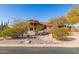 Stunning desert landscape surrounds this single-story home with a terracotta tile roof at 8540 E Mcdowell Rd # 55, Mesa, AZ 85207