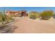 Landscaped front yard with gravel and desert plants leads to a beautiful home at 8540 E Mcdowell Rd # 55, Mesa, AZ 85207