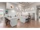 Modern kitchen featuring white cabinets and a large island at 8540 E Mcdowell Rd # 55, Mesa, AZ 85207
