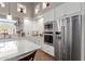 Updated kitchen, featuring stainless steel appliances and white cabinets at 8540 E Mcdowell Rd # 55, Mesa, AZ 85207