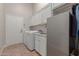 Laundry room with washer, dryer, and extra storage at 8540 E Mcdowell Rd # 55, Mesa, AZ 85207