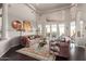 Open living area with high ceilings, hardwood floors, and lots of natural light at 8540 E Mcdowell Rd # 55, Mesa, AZ 85207