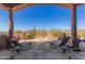 Covered patio with lounge chairs, offering scenic desert views at 8540 E Mcdowell Rd # 55, Mesa, AZ 85207