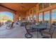 Covered patio with seating area and pool view at 8540 E Mcdowell Rd # 55, Mesa, AZ 85207