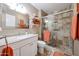 Stylish bathroom with modern fixtures, a tiled shower, and a decorative mirror at 10407 N 108Th Ave, Sun City, AZ 85351