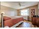 Bedroom showcasing wood-look floors, natural light, and a neutral color scheme at 10407 N 108Th Ave, Sun City, AZ 85351