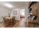 Cozy dining room with wood table, chairs, and accent hutch, blending rustic charm with modern living at 10407 N 108Th Ave, Sun City, AZ 85351