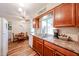 Bright kitchen with wooden cabinetry, stainless steel appliances, and an inviting breakfast nook at 10407 N 108Th Ave, Sun City, AZ 85351