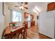 Bright kitchen featuring wood cabinets, tile floors, and a dining area bathed in natural light at 10407 N 108Th Ave, Sun City, AZ 85351