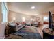 Open-concept living room with wood floors, a large window and comfortable seating at 10407 N 108Th Ave, Sun City, AZ 85351