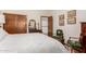 Comfortable guest bedroom with two green chairs and wood dresser at 10425 N 23Rd St, Phoenix, AZ 85028