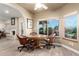 Charming breakfast nook with wood table and leather chairs, overlooking backyard at 10425 N 23Rd St, Phoenix, AZ 85028