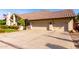 Two-car garage with decorative hardware and landscaping at 10425 N 23Rd St, Phoenix, AZ 85028