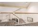 Upstairs hallway with wood floors and view of staircase at 10425 N 23Rd St, Phoenix, AZ 85028