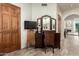 Bedroom with vanity, chair, and view of fireplace at 10425 N 23Rd St, Phoenix, AZ 85028