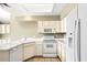 Well-equipped kitchen with white cabinets and appliances at 11515 N 91 St # 238, Scottsdale, AZ 85260